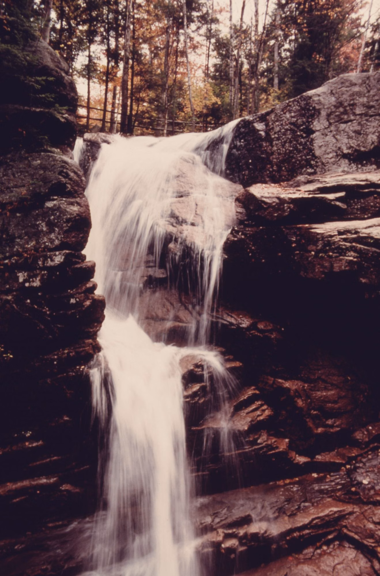Waterfall on Flume Brook pouring between granite walls into the Flume Gorge
